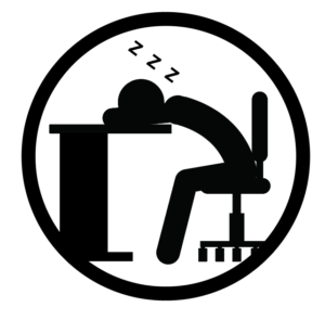 Icon of a person sleeping at a desk depicting the concept of fatigue