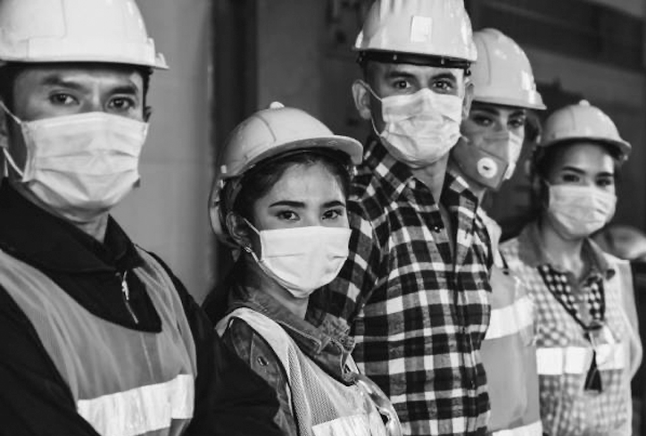 Photo of workers all wearing masks