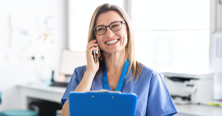 A photo of on occupational health nurse talking on the phone with a patient