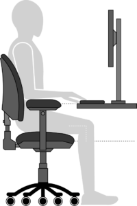 Illustration of a person sitting at a workstation with the keyboard positioned on the workstation at the correct height