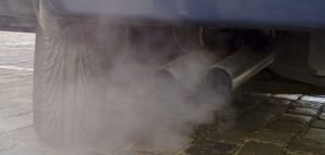 Background photo of exhaust coming out of the exhaust pipes on a vehicle