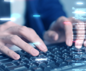 Closeup photo of a person working on a keyboard